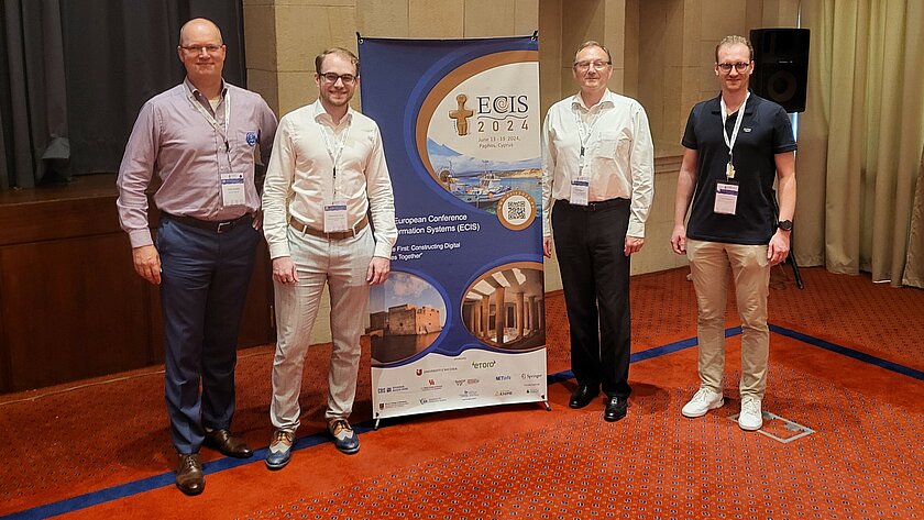 The IDI team at ECIS; from left to right: Prof. Dr. Heiko Gewald, Maximilian Haug, Prof. Dr. Heinz-Theo Wagner, Luca Stegmann.  (opens enlarged image)